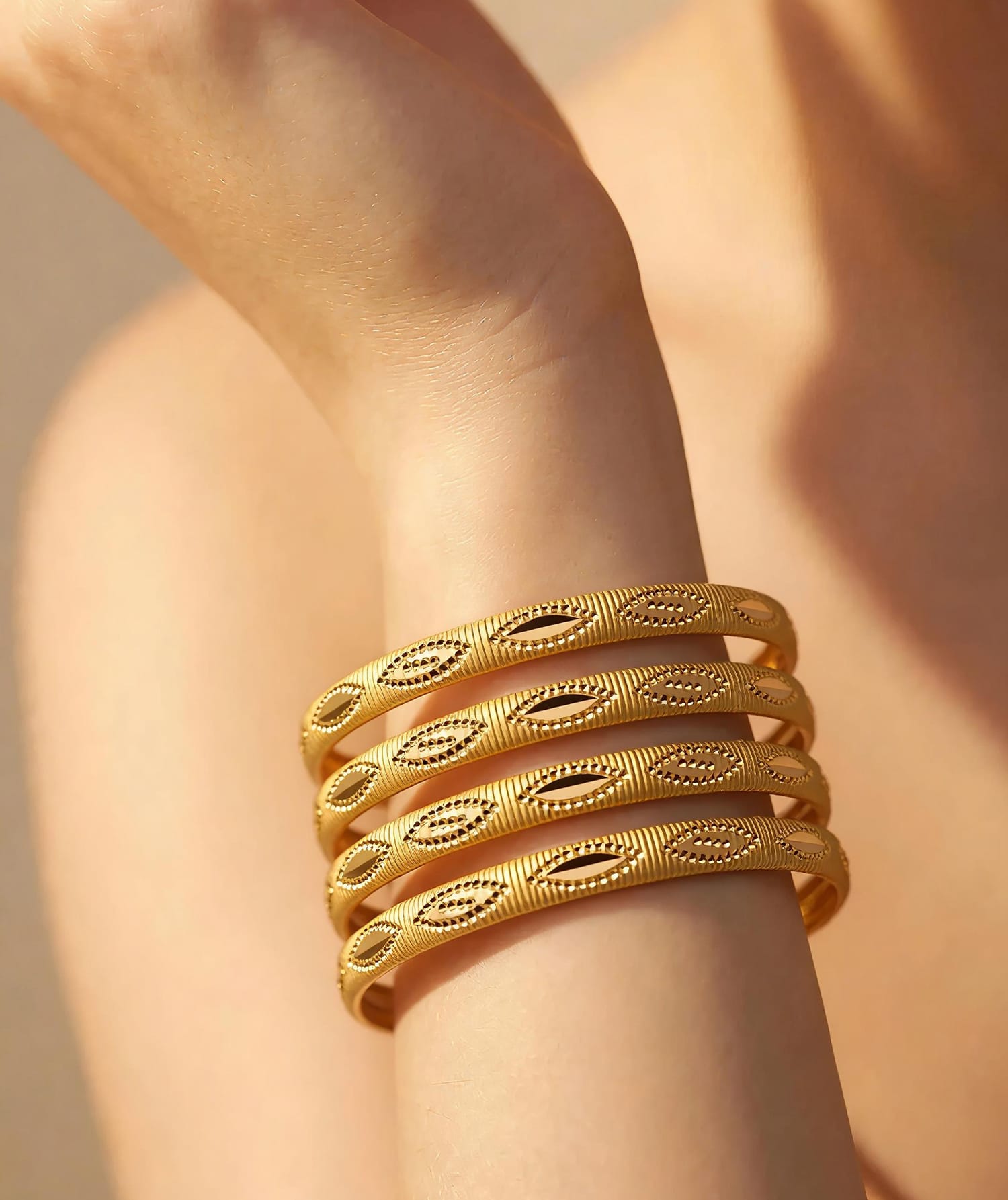 Gold-Plated Kara Set of 4 with Oval Cutout Design